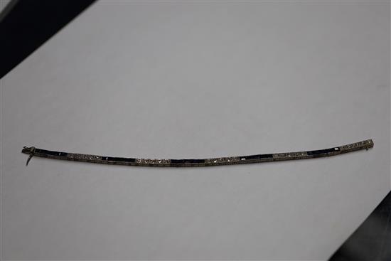 A 1920s 18ct white gold, sapphire and diamond set line bracelet, in original fitted Charles Packer & Co Ltd box.